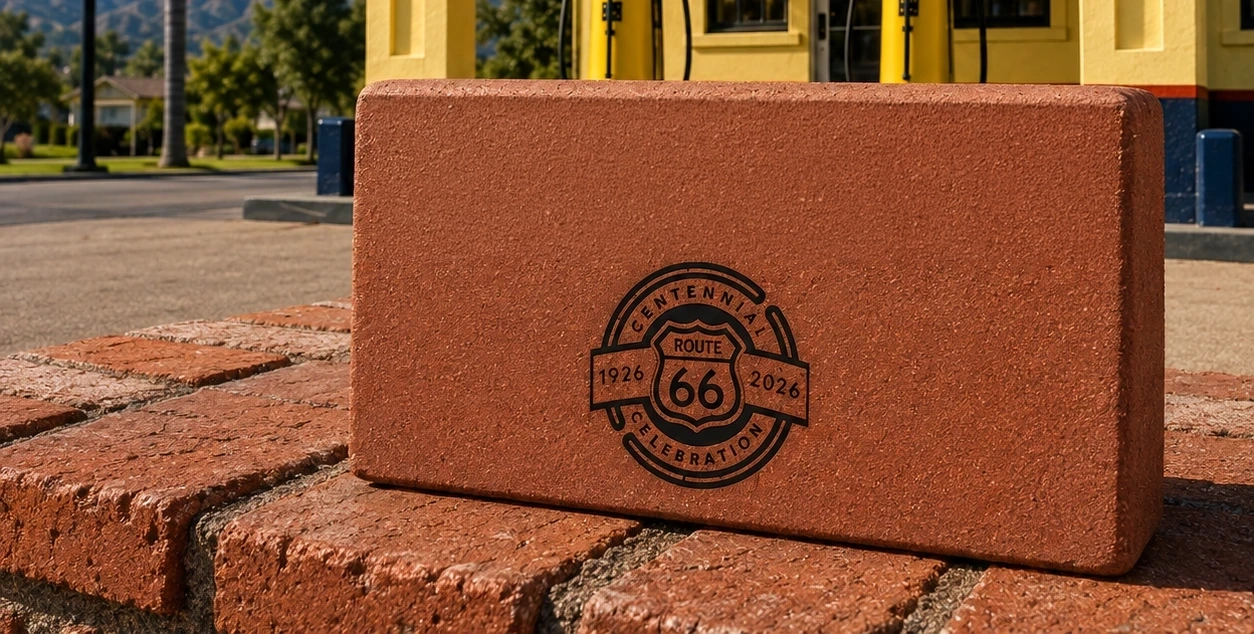 Engraved commemorative brick at the Cucamonga Service Station, with the Route 66 Centennial seal